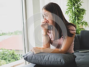 Young attractive and sad woman sitting depressed at home sofa couch feeling anxious and frustrated suffering depression problem,