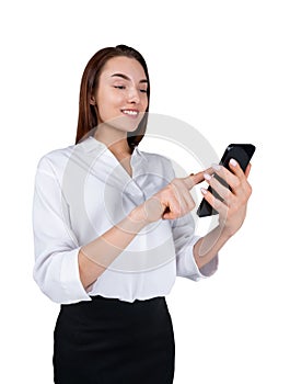 Young attractive smiling businesswoman wearing formal wear typing on smartphone