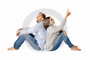 Young attractive smiling couple thinking of future or past together isolated on white and copy space