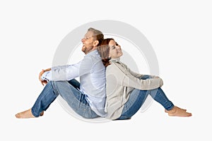 Young attractive smiling couple thinking of future or past together on white and copy space