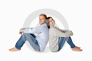 Young attractive smiling couple thinking of future or past together on white and copy space