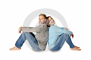 Young attractive smiling couple thinking of future or past together on white and copy space