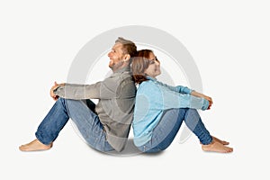 Young attractive smiling couple thinking of future or past together on white and copy space