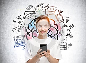 Young attractive smiling student woman with smartphone nearby concrete wall with colorful brain, education and creative icons