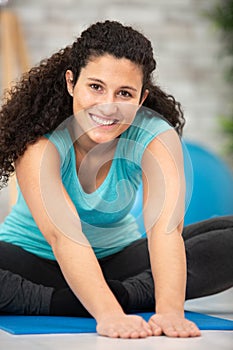 young attractive smiling woman practicing yoga