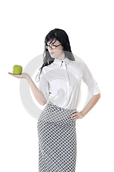 Young attractive teacher holding out green apple