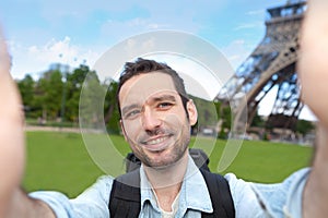 Young attractive tourist taking selfie in Paris