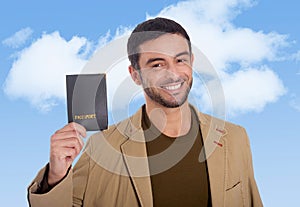 Young attractive traveler man holding passport smiling happy and confident