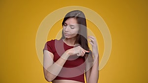 Young attractive woman combing her hair