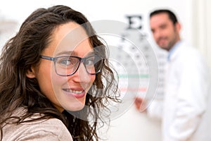 Young attractive woman doing optician test