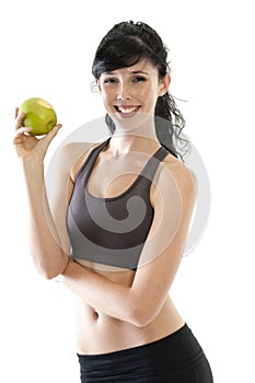 Young attractive woman eating green apple