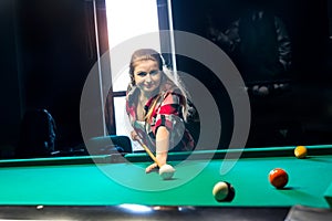 Young and attractive woman going hit a ball