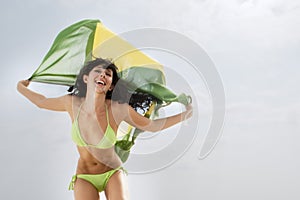 Young attractive woman in green bikini