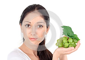 Young attractive woman with green grape cluster