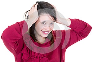 Young attractive woman hands in hair