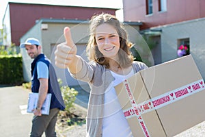 Young attractive woman happy to receive parcel