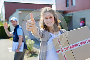 Young attractive woman happy to receive parcel