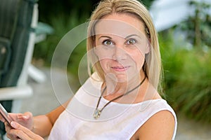 Young attractive woman in her forties looking at the camera