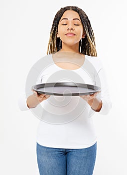 Young attractive woman holding empty pizza tray and sniff good smell food isolated on white background. Copy space and mock up.