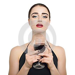 Young attractive woman holding glass of red wine. Lady drinks alcoholic drink