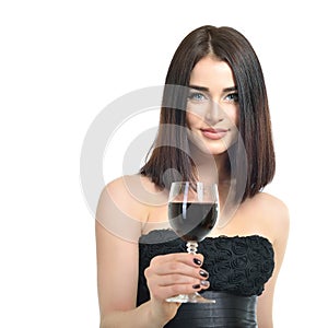 Young attractive woman holding glass of red wine. Pretty lady drinks