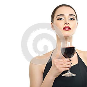 Young attractive woman holding glass of red wine.