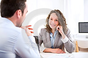 Young attractive woman during job interview