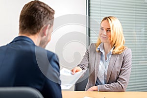 Young attractive woman during job interview