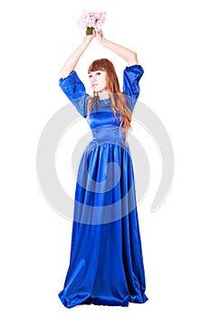 Young attractive woman in a long blue evening dress