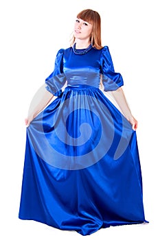 Young attractive woman in a long blue evening dress