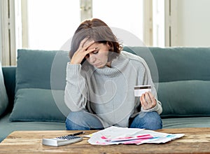 Upset young woman stressed about credit card debts and payments not happy accounting finances