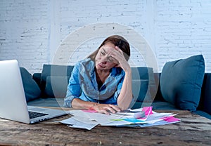 Young attractive woman managing paying bills and calculating finances felling stressed and worried