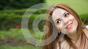 A young attractive woman in an open air