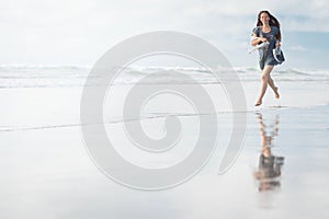 Young attractive woman posing at amazing New Zealand beach