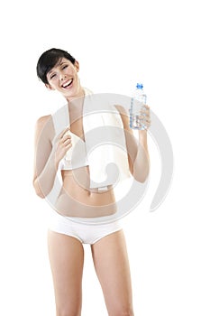 Young attractive woman relaxing with towel and water