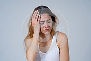 Young attractive woman sad and depressed feeling desperate. Human expressions and emotions