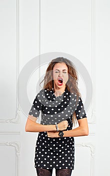 Young attractive woman screaming