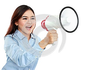 Young attractive woman shouting using megaphone