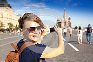 Young attractive woman traveler with backpack on the background