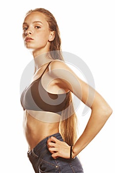 Young attractive woman wet long hair after workout isolated