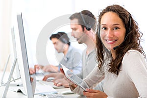 Young attractive woman working in a call center