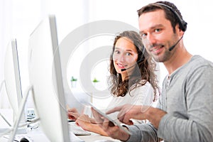 Young attractive woman working in a call center