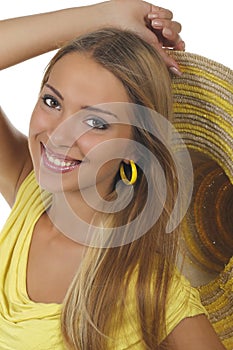 Young attractive woman with yellow shirt and strawhat photo