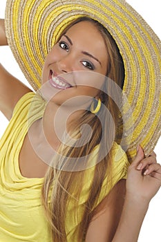 Young attractive woman with yellow shirt and strawhat photo
