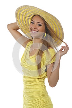 Young attractive woman with yellow shirt and strawhat photo