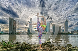 Young attractive woman in yoga posture,