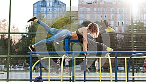 Young attrective crossfit man and woman working out on the sportsground