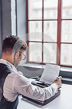 Young author by the window