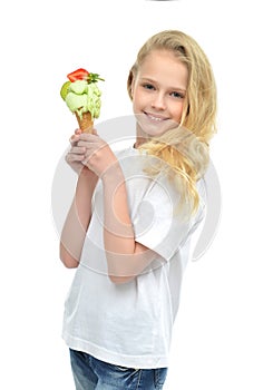 Young baby girl ready for eating green pistachio ice cream in wa