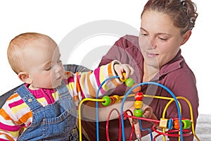 Young baby learning muscle coordination photo